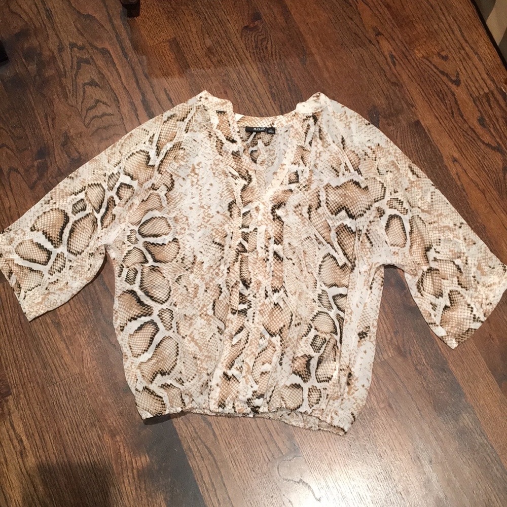 a.n.a. sheer snakeskin patterned polyester top. Size small.